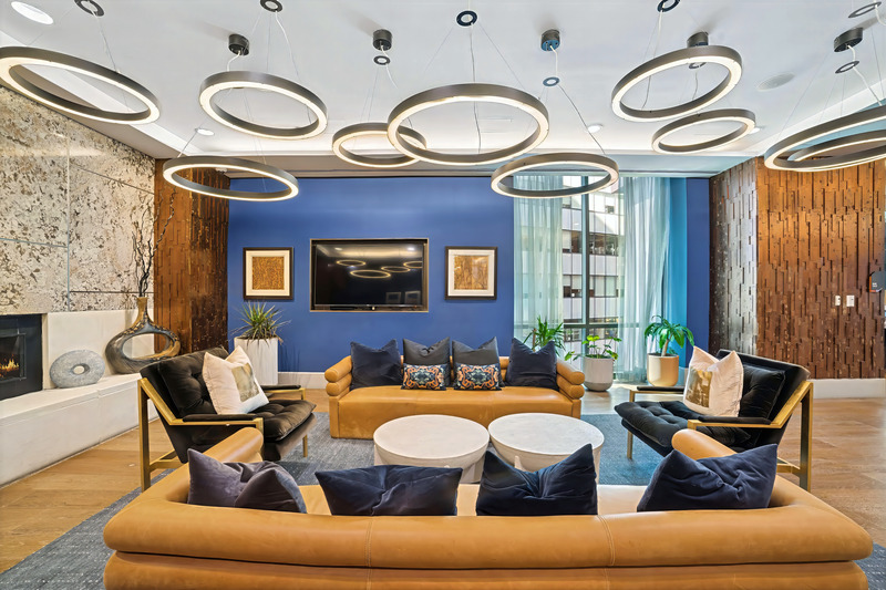 Commercial lounge with seating and sculptural pendant lighting