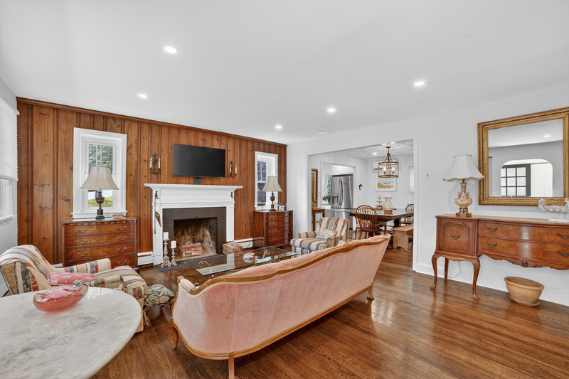 Living room with wood floors and fireplace in Family Home