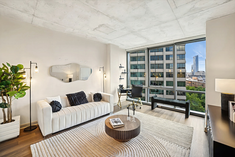 Living room with large windows in Modern Apartment