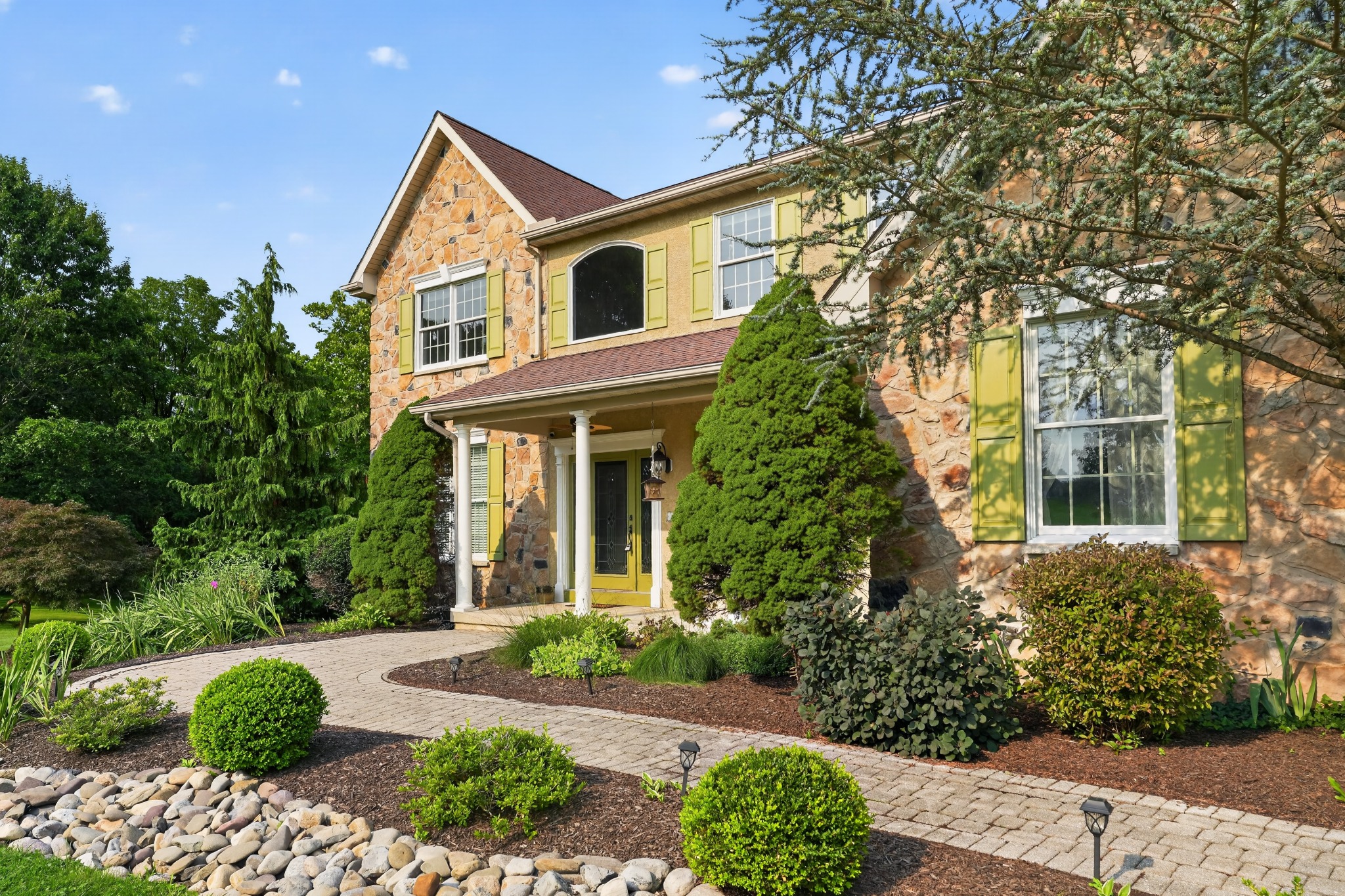Stone residential home exterior in daylight